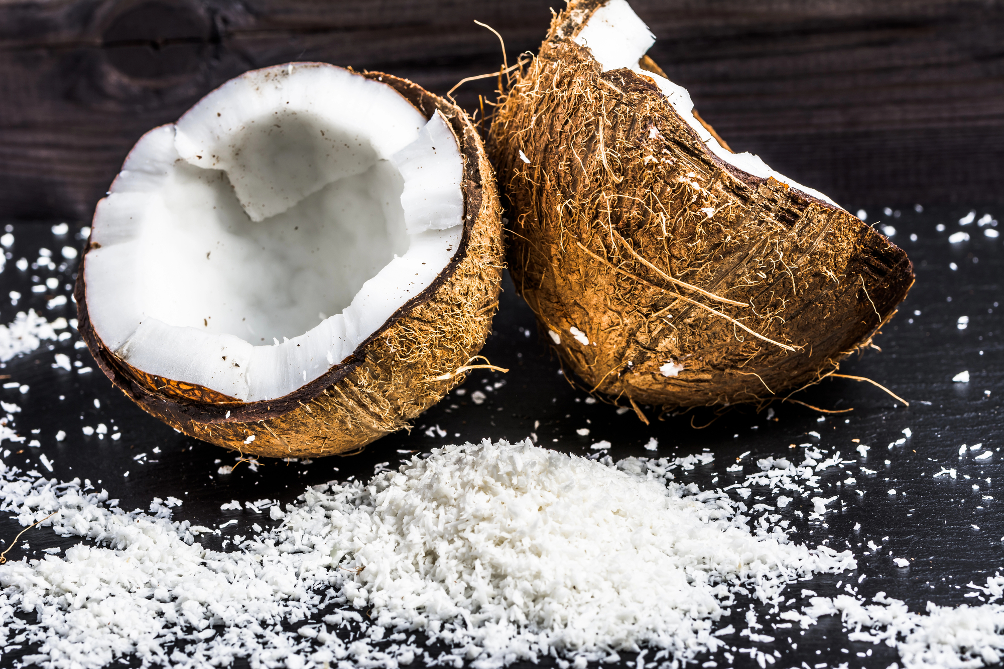 coconut grated cut on black bakcground