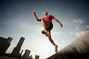 active men running in the city