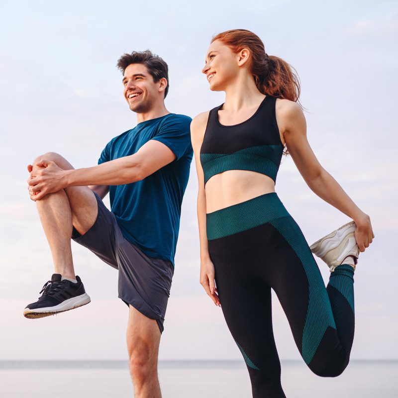 sport joint run man and woman stretching