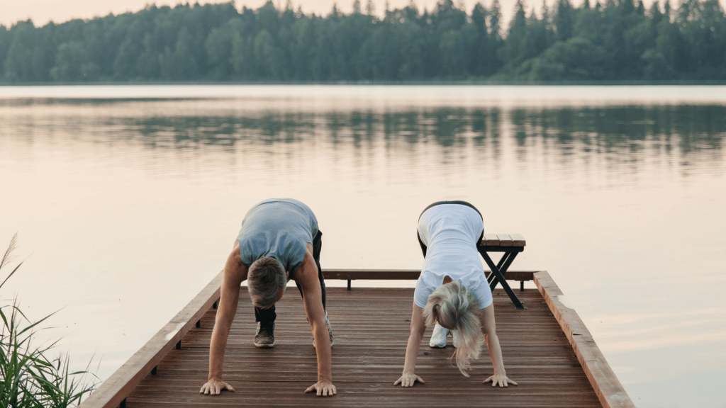 men and women longevity on a lake streching