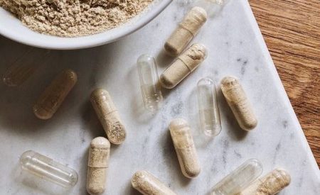 food supplement powder gelule on a table marble